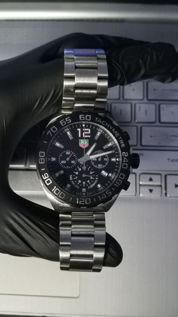 TAG Heuer Formula 1 Chronograph Watch (Category: Luxury Watches) located in Manila. Submitted by mikooo03 (Listing ID 1465940376, Image 3). Description: - Authentic TAG Heuer Formula 1 Chronograph watch - Sleek black dial paired with a sporty tachymeter bezel - 100% working order and keeps accurate time - Complete set: Includes original box, international guarantee card, and manual - Perfect daily driver or statement piece for watch enthusiasts.