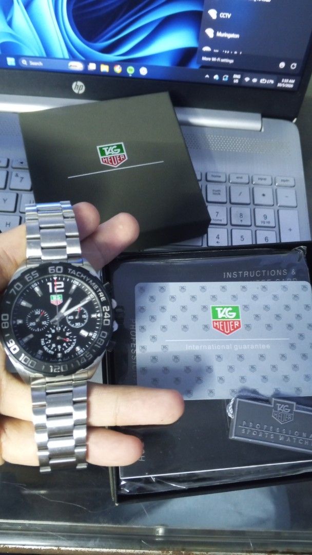 TAG Heuer Formula 1 Chronograph Watch (Category: Luxury Watches) located in Manila. Submitted by mikooo03 (Listing ID 1465940376, Image 2). Description: - Authentic TAG Heuer Formula 1 Chronograph watch - Sleek black dial paired with a sporty tachymeter bezel - 100% working order and keeps accurate time - Complete set: Includes original box, international guarantee card, and manual - Perfect daily driver or statement piece for watch enthusiasts.