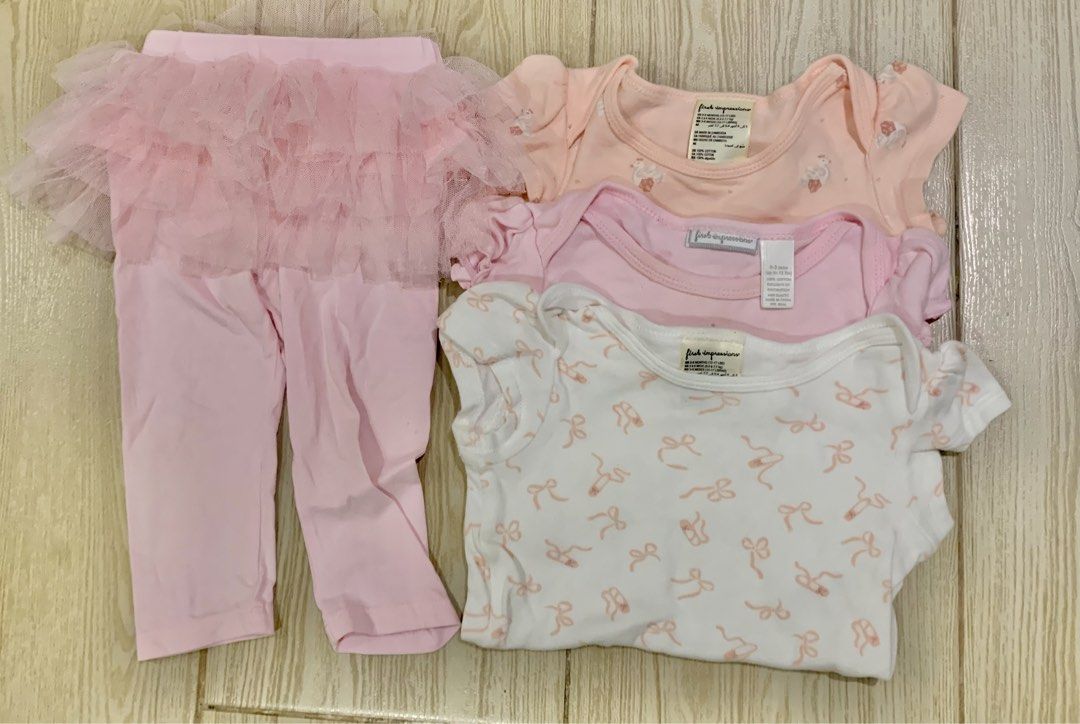 Take all for 550 Bodysuits and Tutu Leggings Bundle (Category: Babies & Kids Fashion) located in Pasig City. Submitted by littleryenstreasures (Listing ID 1465788495, Image 1). Description: - Brand: First Impressions - Material: Soft and comfortable cotton - Set includes: 3 short-sleeve bodysuits (white with bow prints, pink, and peach) and 1 pair of light pink leggings with an attached tutu skirt - Perfect for everyday wear or special occasions 