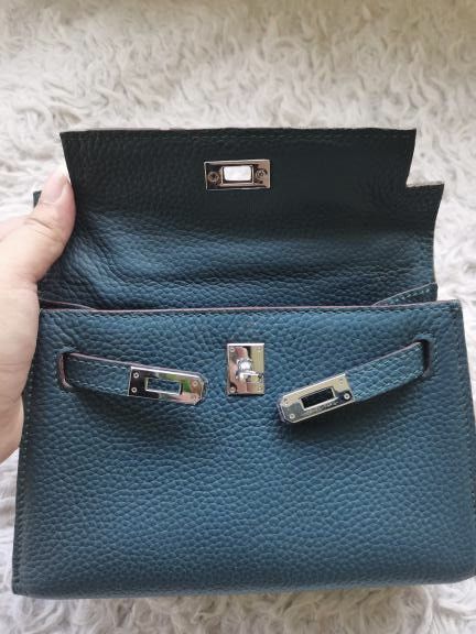 Teal Leather Mini Top Handle Bag with Twilly Scarf (Category: Shoulder Bags) located in Manila. Submitted by geminibibo (Listing ID 1465816914, Image 2). Description: Teal Hermes mini kelly Comes with strap and dust bag Scarf on bag not included hehe.