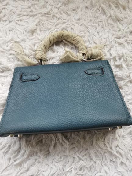 Teal Leather Mini Top Handle Bag with Twilly Scarf (Category: Shoulder Bags) located in Manila. Submitted by geminibibo (Listing ID 1465816914, Image 3). Description: Teal Hermes mini kelly Comes with strap and dust bag Scarf on bag not included hehe.