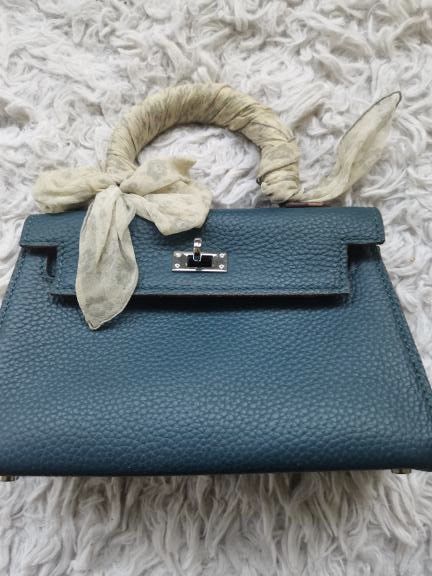 Teal Leather Mini Top Handle Bag with Twilly Scarf (Category: Shoulder Bags) located in Manila. Submitted by geminibibo (Listing ID 1465816914, Image 1). Description: Teal Hermes mini kelly Comes with strap and dust bag Scarf on bag not included hehe.