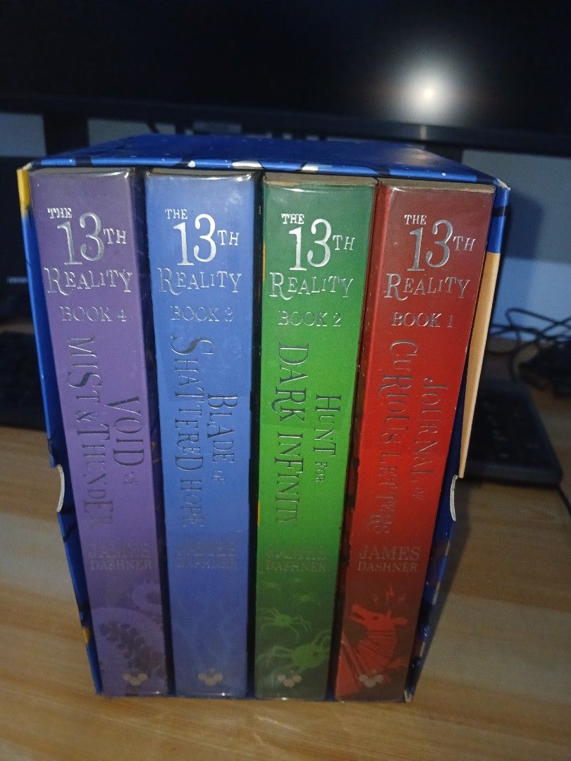 The 13th Reality 4 Book Box Set by James Dashner (Category: Storybooks) located in San Fernando. Submitted by lorien14 (Listing ID 1465886800, Image 2). Description: - Complete 4-book box set: The 13th Reality series by James Dashner (author of The Maze Runner) - Includes: Journal of Curious Letters, Hunt for Dark Infinity, Blade of Shattered Hope, and Void of Mist and Thunder - Packaging: Comes in the original slipcase box - Condition: Yellowing