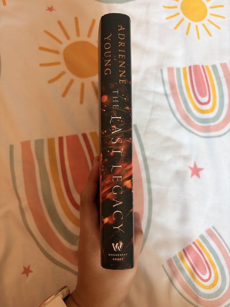 The Last Legacy by Adrienne Young (Category: Storybooks) located in Tarlac. Submitted by noveliaph (Listing ID 1465791412, Image 2). Description: - Title: The Last Legacy by Adrienne Young - Publisher: Wednesday Books (Hardcover) - Genre: YA Fantasy (family secrets and danger) - Condition: Clean pages, solid binding, normal shelf wear on the dust jacket - Perfect for fans of immersive fantasy fiction.