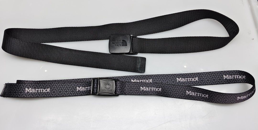 The North Face & Marmot Outdoor Belts Bundle (Category: Belts) located in Baguio. Submitted by thriftjc (Listing ID 1465781803, Image 3). Description: - Bundle includes 2 adjustable webbing belts - Belt 1: Solid black The North Face with sturdy plastic buckle and embossed logo - Belt 2: Patterned Marmot design with repeating logo text and quick-release snap buckle - Standard width and highly durable material - Versatile for both hiking and casual