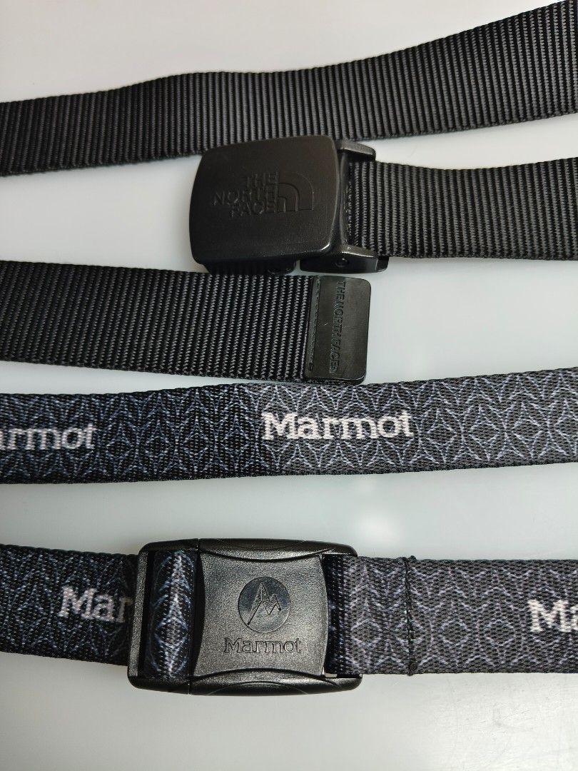 The North Face & Marmot Outdoor Belts Bundle (Category: Belts) located in Baguio. Submitted by thriftjc (Listing ID 1465781803, Image 2). Description: - Bundle includes 2 adjustable webbing belts - Belt 1: Solid black The North Face with sturdy plastic buckle and embossed logo - Belt 2: Patterned Marmot design with repeating logo text and quick-release snap buckle - Standard width and highly durable material - Versatile for both hiking and casual