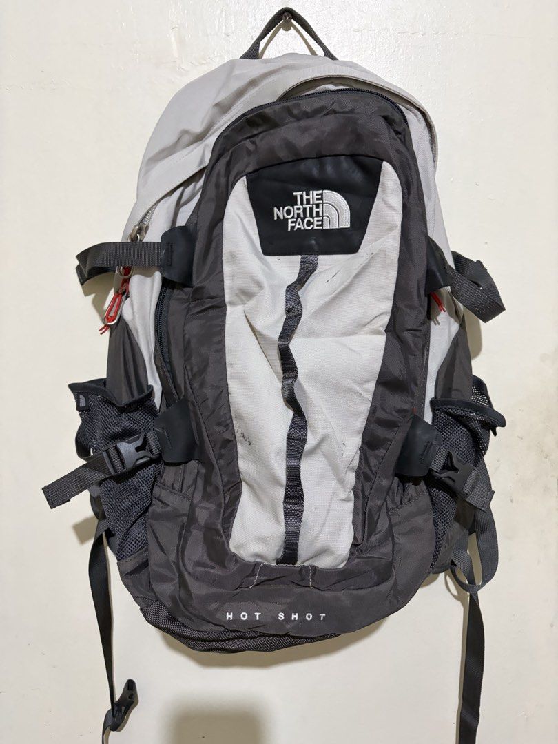 The North Face Hot Shot Backpack 30 liters (Category: Backpacks) located in Manila. Submitted by wiseearth.075b2f (Listing ID 1465788985, Image 1). Description: - The North Face Hot Shot 30 liters -₱2575 nego -madumi lang and sugns of usage -no holes or scratces- zippers are all goods - Stylish grey and white colorway with black accents - Interior hologram tag intact for verification - Features padded shoulder harness and adjustable compression s