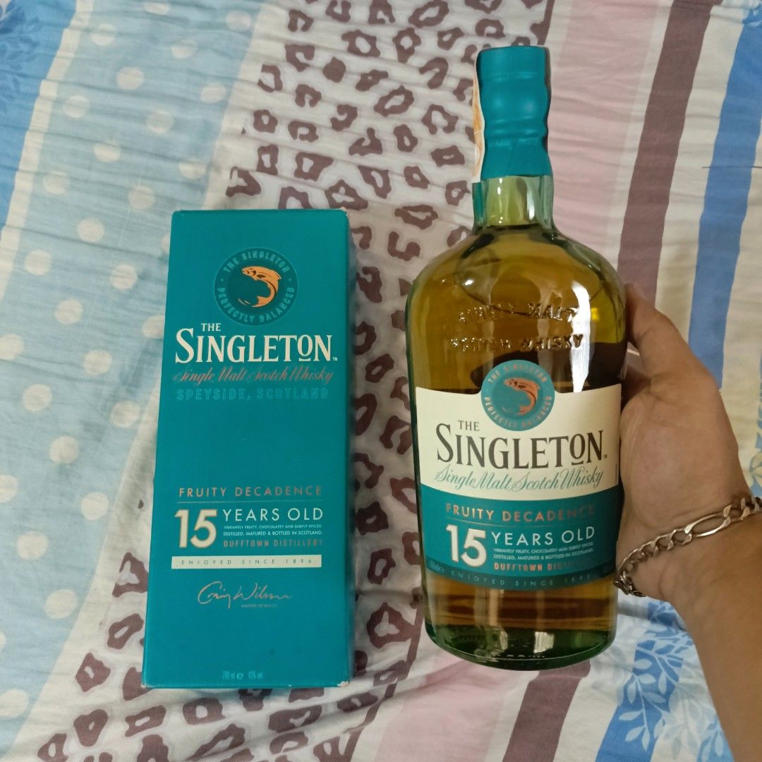 The Singleton 15 Years Old Single Malt Scotch Whisky (Category: Beverages) located in Manila. Submitted by methamphetaminee (Listing ID 1465825818, Image 1). Description: - Item: The Singleton 15 Years Old Single Malt Scotch Whisky - Origin: Dufftown Distillery - Volume: 700ml - Alcohol Content: 40% ABV - Condition: Brand new, unopened, and factory sealed - Packaging: Comes with original turquoise box - Flavor Profile: Rich and fruity decadence -