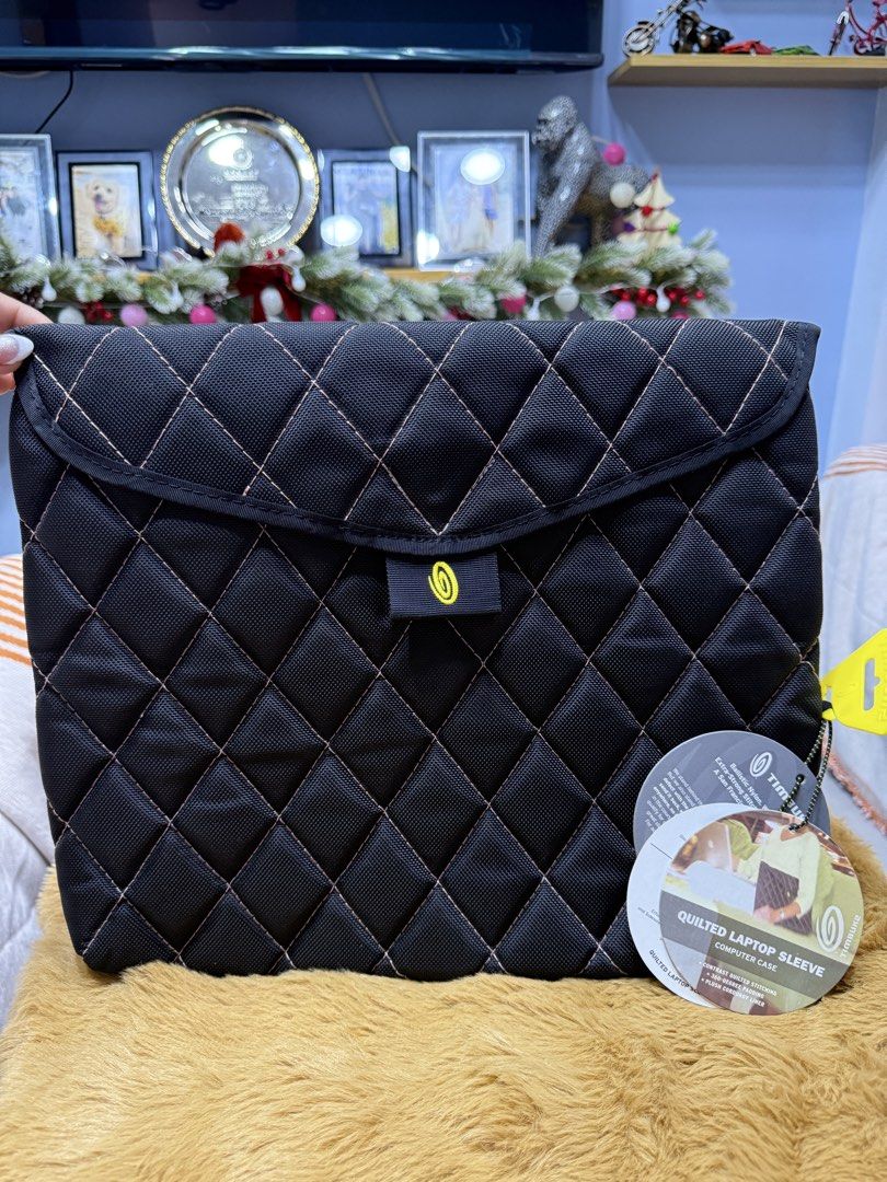 Timbuk2 Quilted Laptop Sleeve Computer Case Black (Category: Laptop Bags & Sleeves) located in Alaminos. Submitted by jhean1323 (Listing ID 1465820358, Image 1). Description: Timbuk2 quilted computer sleeve in black with contrast stitching. Flap closure with Velcro strap. Soft purple corduroy interior lining protects against scratches. 360-degree padding throughout. Original tags still attached..