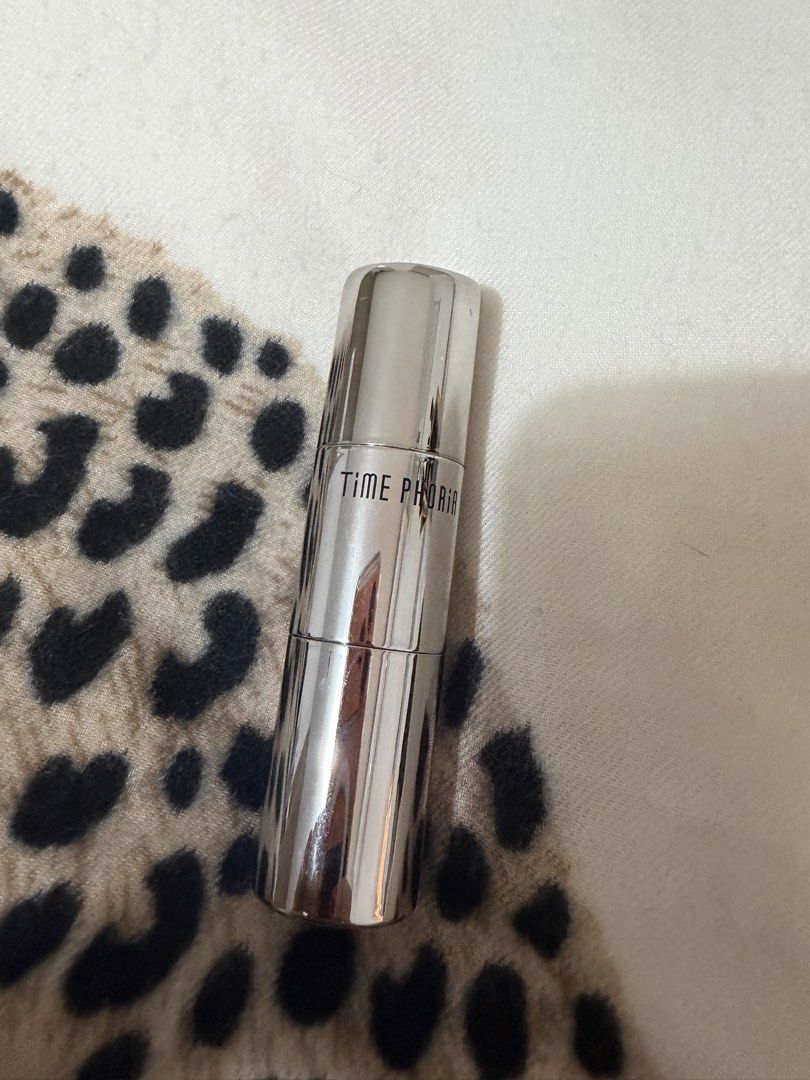 Timephoria Contour and Highlight Stick with Brush (Category: Makeup) located in Manila. Submitted by mengxir20193848 (Listing ID 1465880636, Image 1). Description: - Brand/Model: Timephoria Dual-Ended Makeup Stick - Features: Creamy contour/foundation on one end and a built-in blending brush on the other - Packaging: Sleek silver metallic finish casing with printed branding - Convenience: Handy 2-in-1 design for fast and easy application on the g