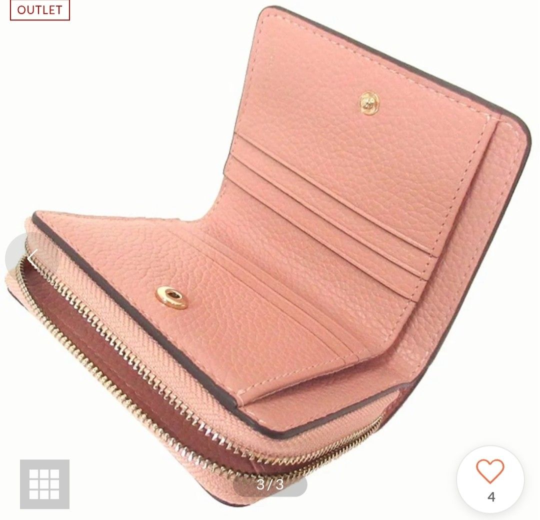 Tory Burch pink leather bi-fold wallet (Category: Luxury Bags & Wallets) located in Mandaluyong City. Submitted by declutterpreloved2.0 (Listing ID 1465818367, Image 2). Description: - Brand: Tory Burch - Material: Pink pebbled leather with gold-tone hardware - Closure: Snap closure for the main compartment, zipper for the coin pocket - Interior: Multiple card slots and cash compartments - Exterior: Debossed logo on front flap and a zippered coin