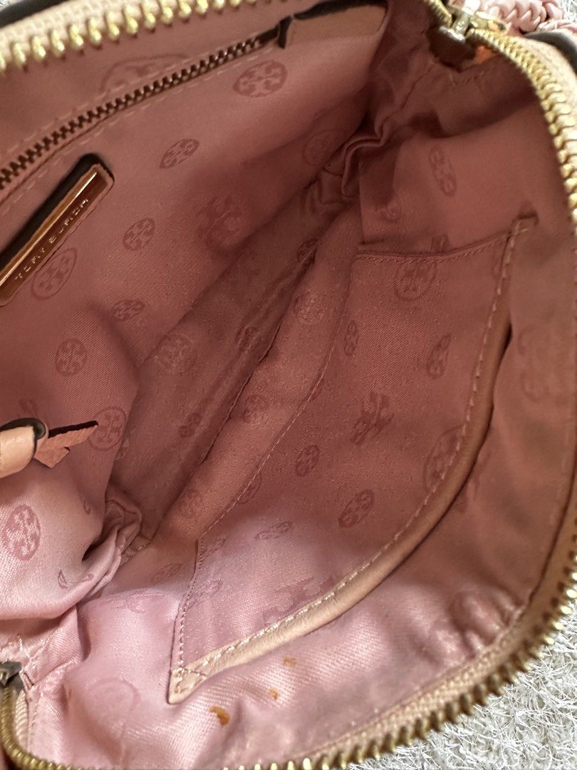 Tory Burch Pink Leather Crossbody Bag (Category: Luxury Bags & Wallets) located in Manila. Submitted by aisasalvad24335 (Listing ID 1465801410, Image 3). Description: - Brand: Tory Burch - Material: Soft pink pebbled leather with gold-tone hardware - Design: Stylish braided shoulder strap and playful side tassel accents - Closure: Top zip closure - Interior: Pink logo-print fabric lining featuring one zip pocket and one slip pocket - Size: Compac