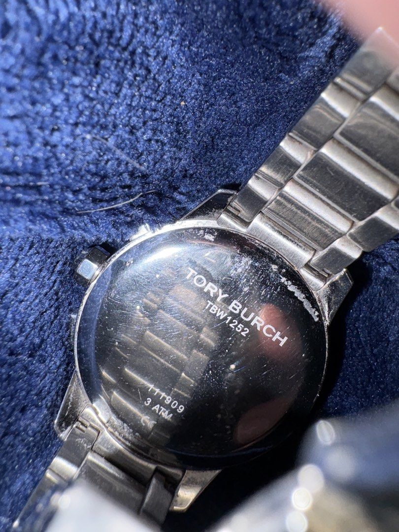 Tory Burch TBW1252 Silver Chronograph Watch (Category: Women's Watches) located in Marikina City. Submitted by leather.and.others (Listing ID 1465882014, Image 2). Description: - Brand: Tory Burch - Model: TBW1252 - Material: 38 mm Stainless steel (silver-tone link bracelet with butterfly clasp) - Dial: Silver with 3 sub-dials and date window at 3 o'clock - Water Resistance: 3 ATM - Condition: Normal surface scuffs from everyday wear on the case 