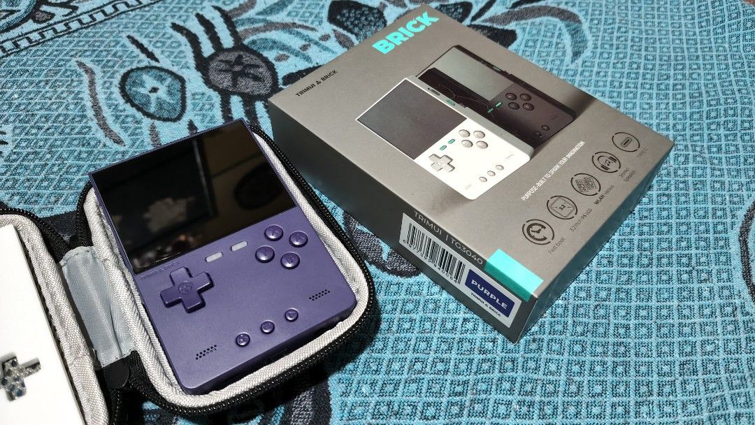 TrimUI BRICK Handheld Console Purple 4gb (Category: Others) located in Manila. Submitted by lauraarseid (Listing ID 1465893556, Image 1). Description: TrimUI BRICK Handheld gaming console Purple Color 4gb MicroSD NextUI OS Can play games UpTo PS1 and some PSP and Portmaster... Like New and Pristine Condition with tempered glass installed, all accessories and box, extra shoulder buttons and charger are unused. Also comes with official TrimUI Hard 