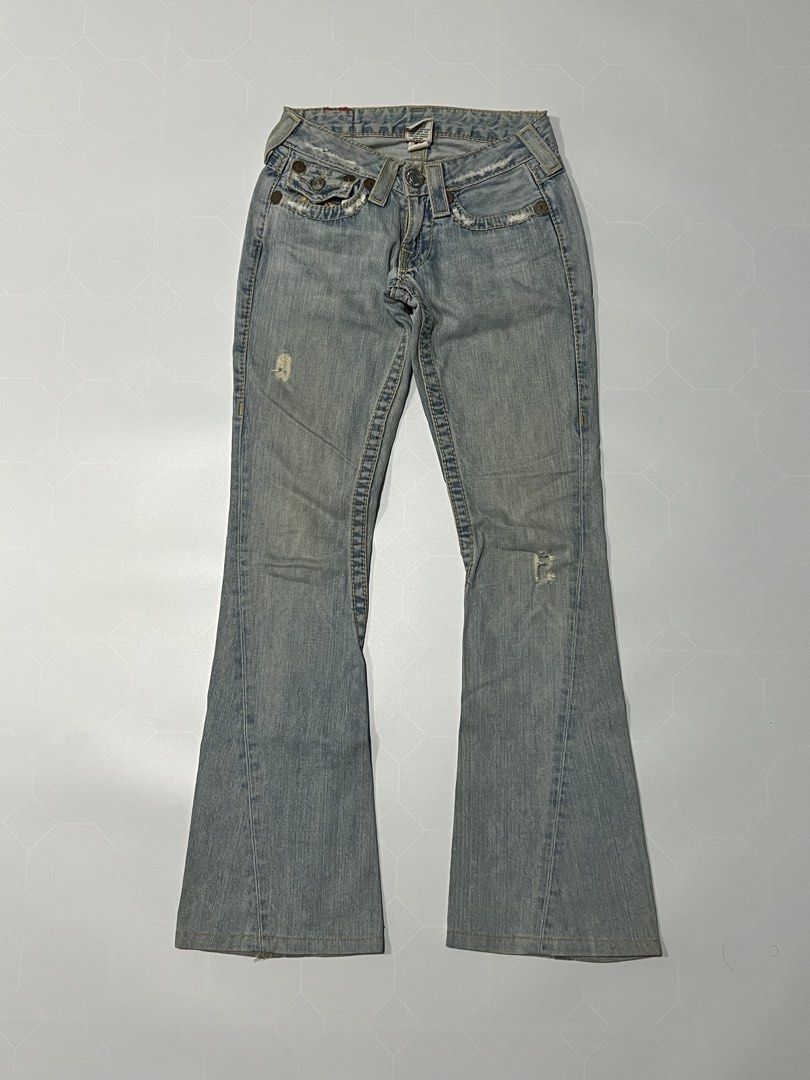 True Religion Flared Denim Jeans Distressed (Category: Jeans) located in Caloocan City. Submitted by lostarchive_55 (Listing ID 1465919823, Image 2). Description: - Brand: True Religion - Wash: Light blue - Cut: Flare leg with mid-rise fit - Details: Distinctive contrast stitching, back flap pockets, and trendy distressed/frayed edges - Closure: Button - Authenticity: RN 112790 on interior tag - Style: Perfect Y2K aesthetic.