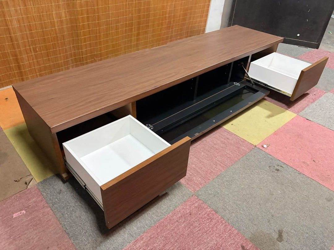 Tv Rack UpTo 80" (Category: TV Consoles) located in Meycauayan. Submitted by marygracecasimiro (Listing ID 1465850572, Image 2). Description: 😍UPTO 80-INCH TV!!! LONG Modern Tv Rack Cabinet with Drawers Central Black Glass Drop Down Cabinet SLEEK DESIGN!!! UPTO 80-INCH TV!!! *SEE VIDEO COMMENT ✅Price : ₱11,000 only ✅ 71L x 17W x 13H inches In VERY good condition♥️.