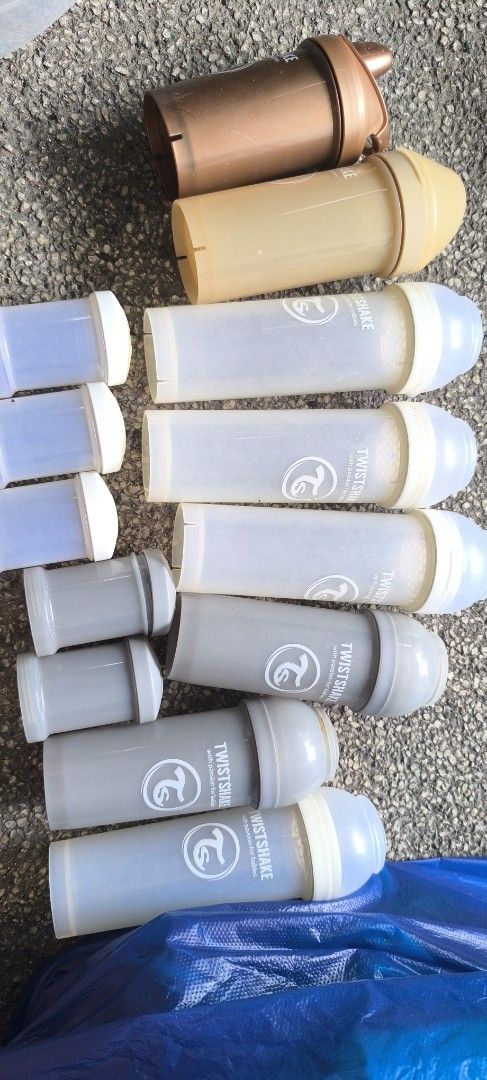 Twistshake Baby Bottles and Powder Containers Bundle (Category: Breastfeeding & Bottle Feeding) located in Manila. Submitted by patriciagem (Listing ID 1465807716, Image 2). Description: - Brand: Twistshake - Includes: Baby bottles and matching powder container storage cups - Colours: Grey, white, tan, and bronze - Features: Mix and match designs, ideal for organizing feeds on the go - Condition: Used with normal signs of wear.