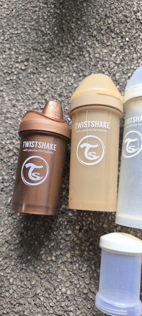 Twistshake Baby Bottles and Powder Containers Bundle (Category: Breastfeeding & Bottle Feeding) located in Manila. Submitted by patriciagem (Listing ID 1465807716, Image 1). Description: - Brand: Twistshake - Includes: Baby bottles and matching powder container storage cups - Colours: Grey, white, tan, and bronze - Features: Mix and match designs, ideal for organizing feeds on the go - Condition: Used with normal signs of wear.