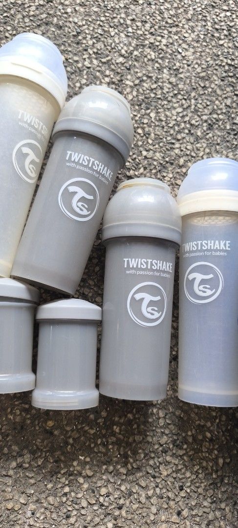 Twistshake Baby Bottles and Powder Containers Bundle (Category: Breastfeeding & Bottle Feeding) located in Manila. Submitted by patriciagem (Listing ID 1465807716, Image 3). Description: - Brand: Twistshake - Includes: Baby bottles and matching powder container storage cups - Colours: Grey, white, tan, and bronze - Features: Mix and match designs, ideal for organizing feeds on the go - Condition: Used with normal signs of wear.