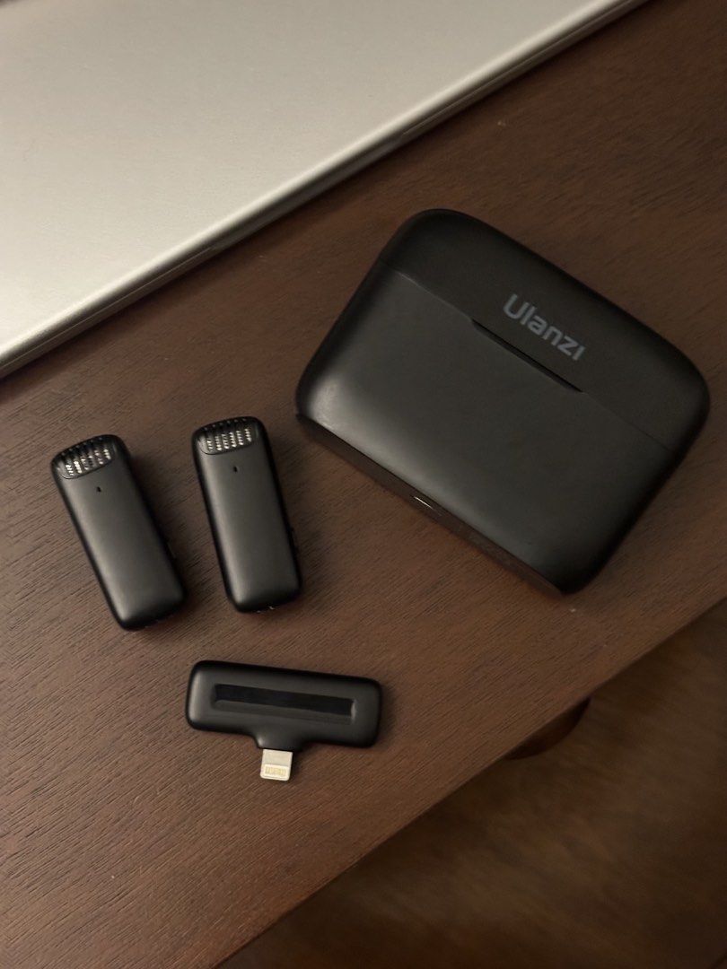 Ulanzi Wireless Lavalier Microphone Set (Category: Microphones) located in Marikina City. Submitted by vadaleienriquez (Listing ID 1465840014, Image 3). Description: - Model: Ulanzi Wireless Lavalier Microphone System - Compatibility: iOS devices (Lightning receiver) - Inclusions: Charging case, 2 transmitters, 1 receiver - Condition: Fully functional, ready to use (slight light surface wear on case from bag carry) - Best for: Content creation, v