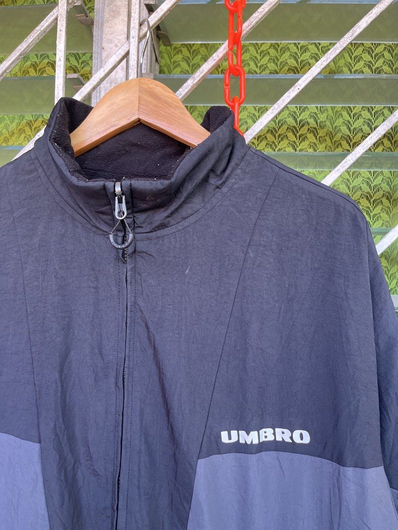 Umbro Reversible Black and Grey Jacket (Category: Coats, Jackets and Outerwear) located in Pilar. Submitted by fast-flip-ni-miko. (Listing ID 1465825176, Image 2). Description: - Brand: Umbro - Style: Reversible full-zip jacket - Colorway: Black and grey - Materials: Durable nylon on one side, soft black fleece on the other - Features: High collar, front pockets, and branded zipper pull tab - Fit: Regular fit, great for everyday wear and layering