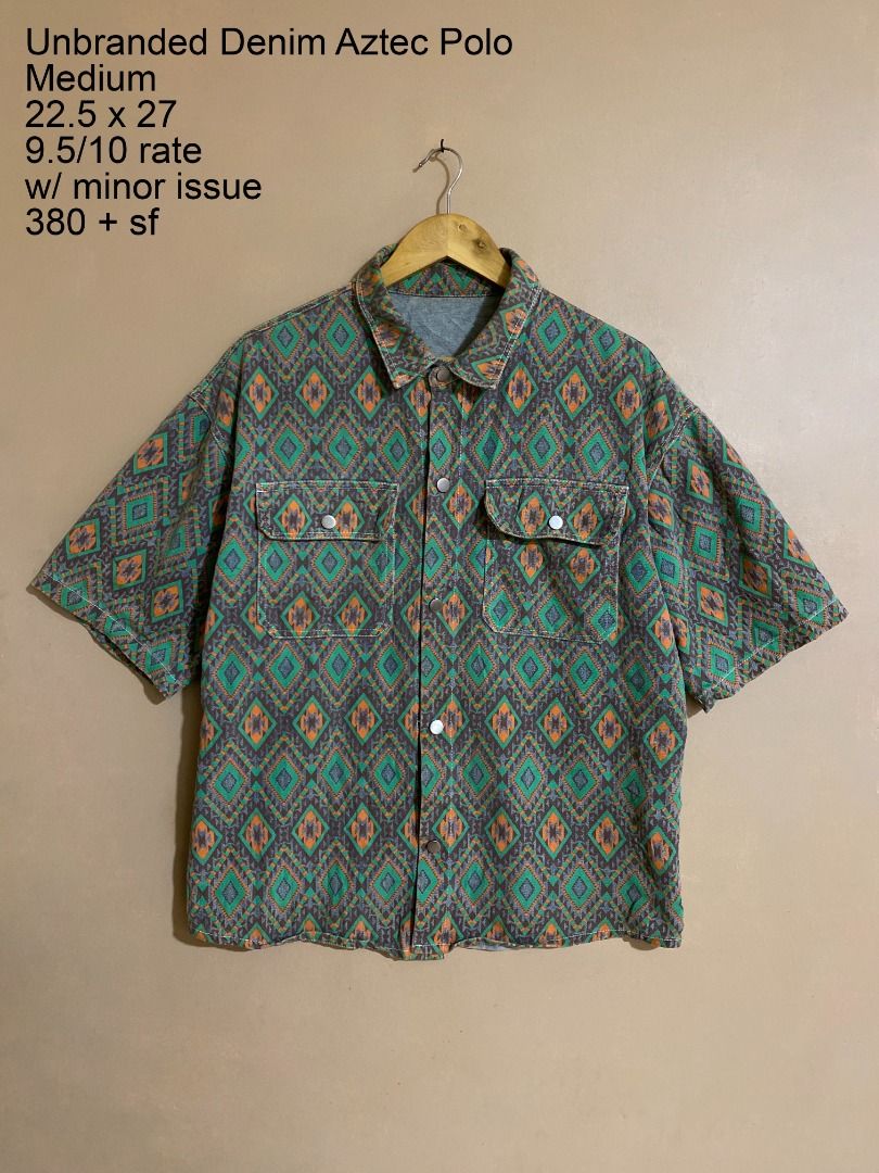 Unbranded Denim Aztic Snap Button Polo (Category: Tshirts & Polo Shirts ) located in Cadiz. Submitted by thespotcdz (Listing ID 1465847468, Image 1). Description: Medium on tag Width 22.5" Length 27" 9.5/10 rate w/ issue on the snap of the left pocket.