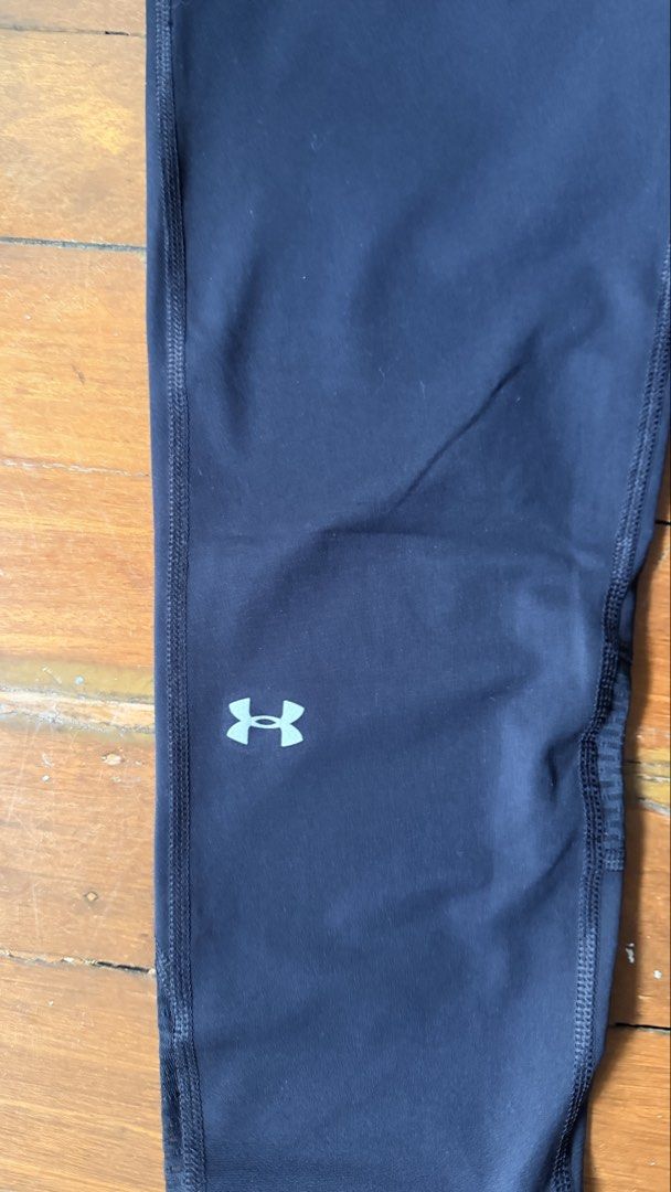 Under Armour Compression Leggings Medium Black (Category: Activewear) located in Quezon City. Submitted by bonkee_declutters (Listing ID 1465790857, Image 3). Description: - Color: black - Fabric: Smooth and stretchy with minimal wear - Key Features: Textured ribbed panels behind knees for extra flexibility - Storage: Small zippered pocket at the back waistband - Safety: Reflective strips near lower shins for night running RFS: not using it anymo