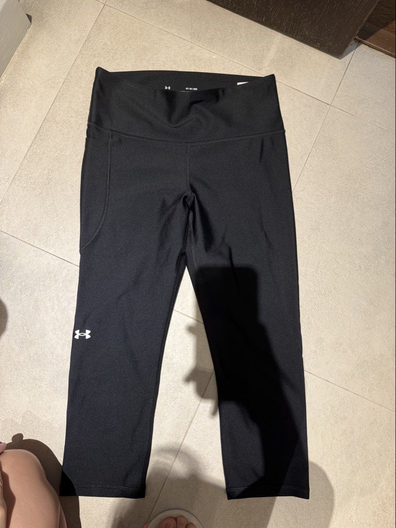 Under armour Jogging pants Bundle (Category: Activewear) located in Makati City. Submitted by rockandraw (Listing ID 1465859482, Image 3). Description: - Brand: Under Armour - Size: Medium (Bundle of 2 pairs) - Pair 1: Grey with Celliant technology and black ankle accents - Pair 2: Solid black with compression fit - Features: Convenient side pockets on both pairs and signature Under Armour logo - Condition: Great for workouts, running errands, or