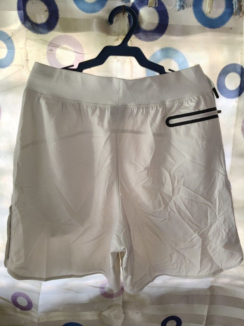 Under Armour Project Rock Workout Shorts White Small (Category: Shorts) located in Compostela. Submitted by johnwilz1144610 (Listing ID 1465765101, Image 3). Description: - Brand: Under Armour Project Rock - Color: white/Cream - Size: Small(29-30waist) - Material: Lightweight performance fabric - Waistband: Adjustable with drawstring - Storage: Secure zippered back pocket and zippered side pockets - Details: Project Rock bull logo and 'Built for 
