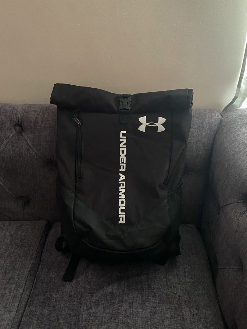 Under Armour Roll Top Sackpack (Category: Backpacks) located in Davao. Submitted by sellsell2002 (Listing ID 1465761061, Image 1). Description: Under Armour Roll Top Sackpack In Black Like new condition No flaws Pwede pang ride,hike,office etc. Waterproof .