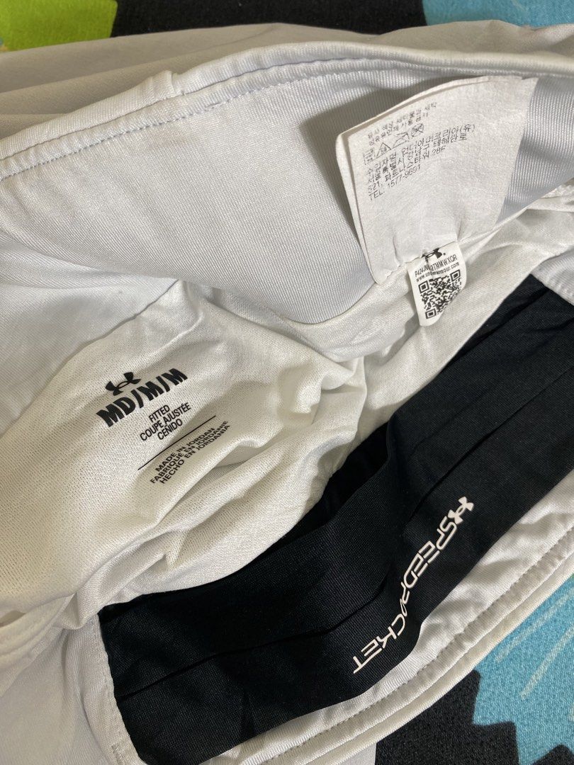 Under Armour Speedpocket Fitted Shorts White (Category: Activewear) located in Cebu City. Submitted by theloose.thread (Listing ID 1465919941, Image 3). Description: - Brand: Under Armour - Size: Medium - Color: White - Style: Fitted with built-in Speedpocket for secure phone storage - Design: Bold UA graphic print down the left leg and small logo on the right hem - Material: Lightweight performance fabric made in Jordan - Ideal for: Running and 