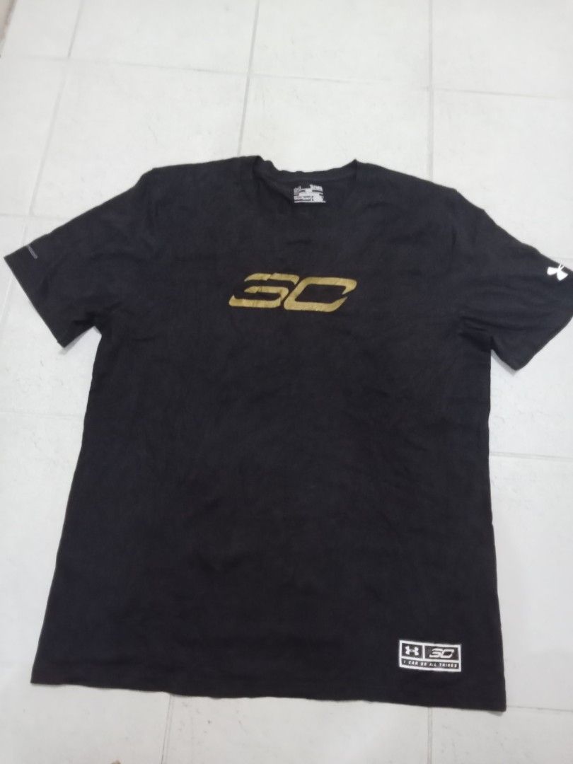 Under Armour Stephen Curry Back 2 Back MVP T-Shirt (Category: Tshirts & Polo Shirts ) located in Manila. Submitted by kitkathrift (Listing ID 1465868416, Image 1). Description: - Brand: Under Armour x Stephen Curry - Design: Back 2 Back MVP graphic with metallic gold SC logo and two stars - Size: XL (Loose Fit) - Color: Black - Details: Sleeve branding and jock tag hem patch - Condition: Good, neck tag intact.