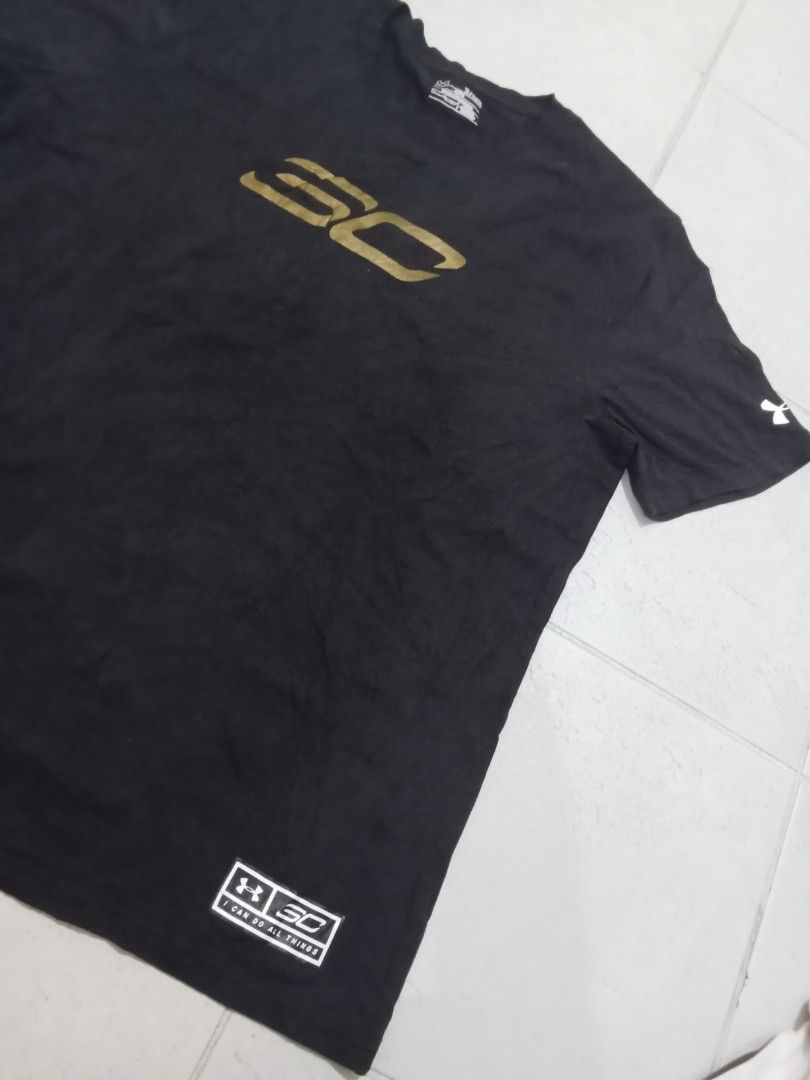 Under Armour Stephen Curry Back 2 Back MVP T-Shirt (Category: Tshirts & Polo Shirts ) located in Manila. Submitted by kitkathrift (Listing ID 1465868416, Image 3). Description: - Brand: Under Armour x Stephen Curry - Design: Back 2 Back MVP graphic with metallic gold SC logo and two stars - Size: XL (Loose Fit) - Color: Black - Details: Sleeve branding and jock tag hem patch - Condition: Good, neck tag intact.