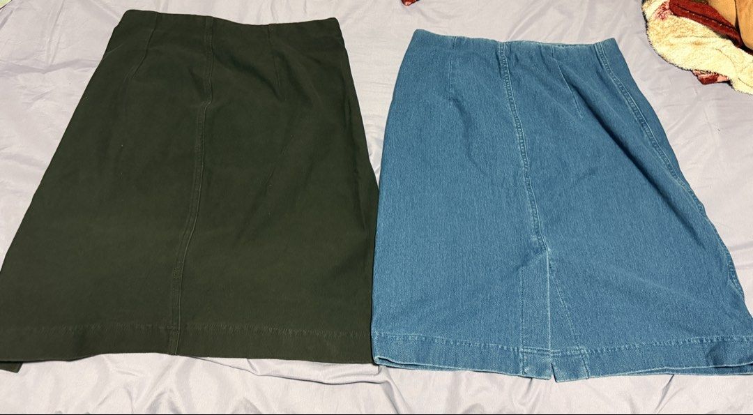 Uniqlo Cotton A Line Skirts Bundle Size L (Category: Skirts) located in Paranaque City. Submitted by keyas.preloved (Listing ID 1465879891, Image 1). Description: - Bundle includes 2 Uniqlo skirts: Dark Green and Denim Blue - Size: L (fits waist 69 to 75 cm) - Material: Cotton and spandex mix (very stretchy and comfortable) - Fit: Straight cut with stylish front seam detail - Condition: Brand new with tags intact inside waistband - Perfect staple