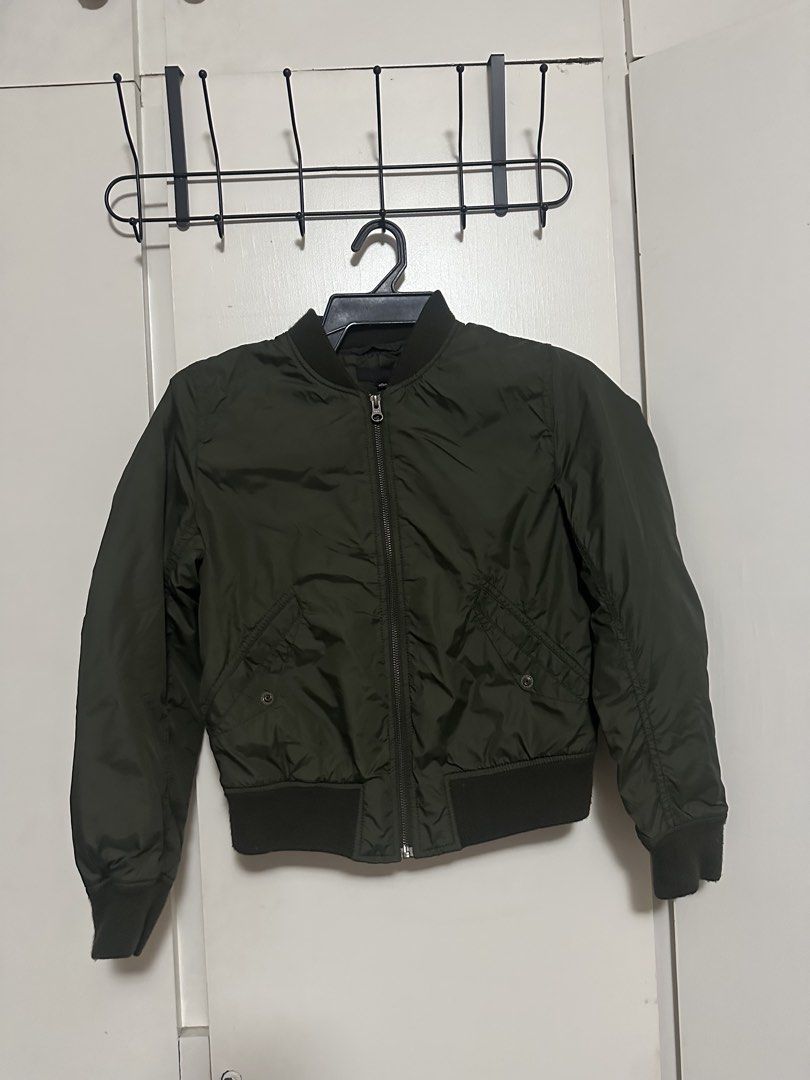Uniqlo Olive Green Bomber Jacket Size S (Category: Coats, Jackets and Outerwear) located in Makati City. Submitted by biancak20 (Listing ID 1465892973, Image 1). Description: - Brand: Uniqlo - Item: Bomber jacket - Color: Olive green - Size: S (Made in Indonesia) - Condition: Clean, excellent overall - Features: Front zipper closure, ribbed collar, cuffs, and hem, plus two front snap-button pockets - Style: Lightweight and versatile for layering 