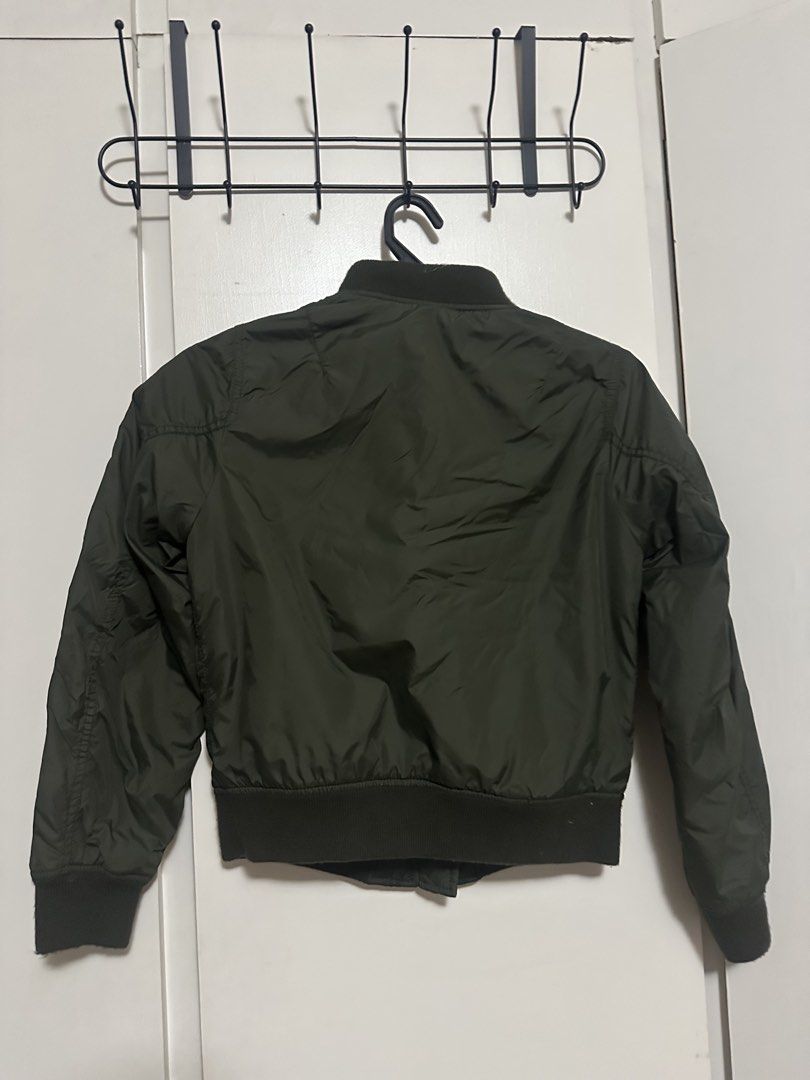 Uniqlo Olive Green Bomber Jacket Size S (Category: Coats, Jackets and Outerwear) located in Makati City. Submitted by biancak20 (Listing ID 1465892973, Image 2). Description: - Brand: Uniqlo - Item: Bomber jacket - Color: Olive green - Size: S (Made in Indonesia) - Condition: Clean, excellent overall - Features: Front zipper closure, ribbed collar, cuffs, and hem, plus two front snap-button pockets - Style: Lightweight and versatile for layering 