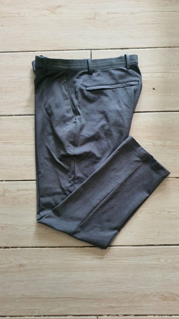 Uniqlo Smart Ankle Pants Grey Medium (Category: Trousers) located in Marikina City. Submitted by martin.is.next (Listing ID 1465945128, Image 3). Description: PERSONAL COLLECTION NOT THRIFTED - Brand: Uniqlo - Color: Grey - Size: S - Origin: Made in Vietnam - Material: 100% polyester body with nylon and spandex blends on the face and elastic parts - Lining: Breathable mesh inner lining - Versatility: Great everyday trousers for work or casual out