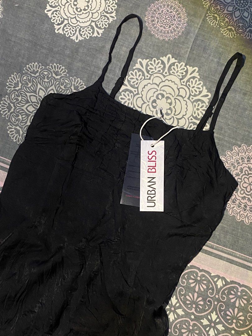 Urban Bliss — Black Slip Mini Dres (Category: Dresses) located in Rizal. Submitted by pcesspscl145 (Listing ID 1465916636, Image 2). Description: - Brand: Urban Bliss - Condition: Brand new with original store tag attached - Color: Classic Black - Details: Crinkled fabric texture, straight neckline, thin adjustable shoulder straps - Fit: Short length, lightweight and comfortable material.