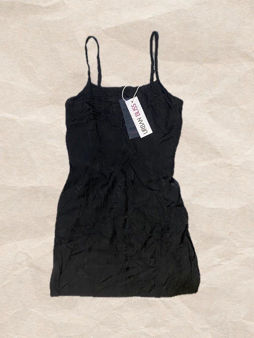 Urban Bliss — Black Slip Mini Dres (Category: Dresses) located in Rizal. Submitted by pcesspscl145 (Listing ID 1465916636, Image 1). Description: - Brand: Urban Bliss - Condition: Brand new with original store tag attached - Color: Classic Black - Details: Crinkled fabric texture, straight neckline, thin adjustable shoulder straps - Fit: Short length, lightweight and comfortable material.
