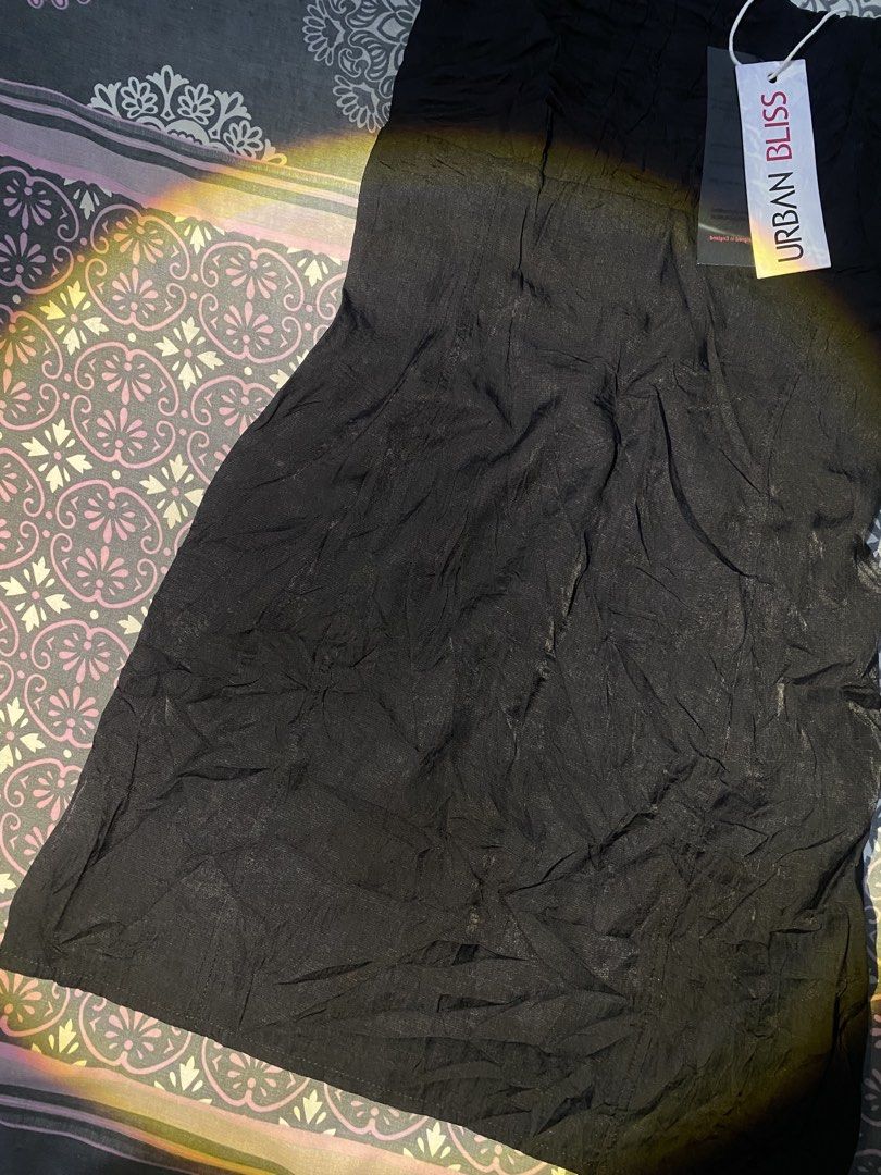 Urban Bliss — Black Slip Mini Dres (Category: Dresses) located in Rizal. Submitted by pcesspscl145 (Listing ID 1465916636, Image 3). Description: - Brand: Urban Bliss - Condition: Brand new with original store tag attached - Color: Classic Black - Details: Crinkled fabric texture, straight neckline, thin adjustable shoulder straps - Fit: Short length, lightweight and comfortable material.
