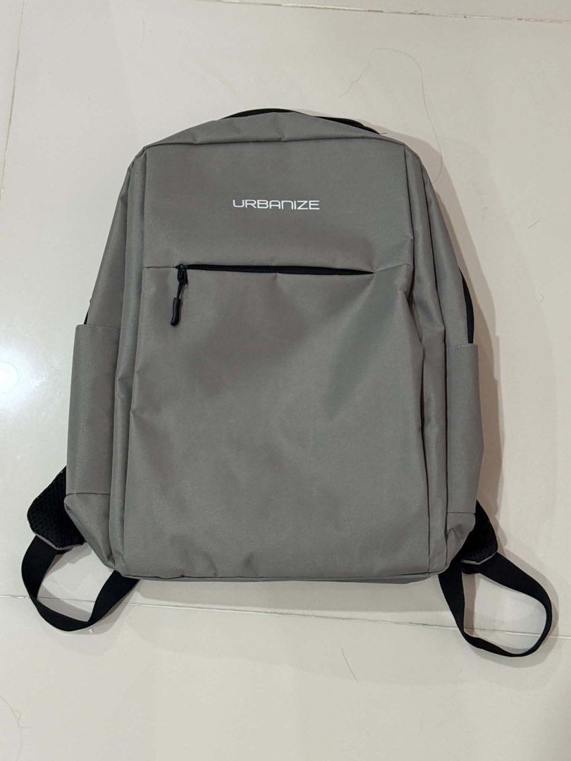 Urbanize Grey Casual Backpack (Category: Backpacks) located in Cabuyao City. Submitted by seokjinspree (Listing ID 1465762181, Image 1). Description: Brand: Urbanize Color: Grey with sleek black zippers Storage: Spacious main compartment with inner sleeve divider Quick Access: Convenient front zipped pocket Comfort: Adjustable shoulder straps and sturdy top carry handle.