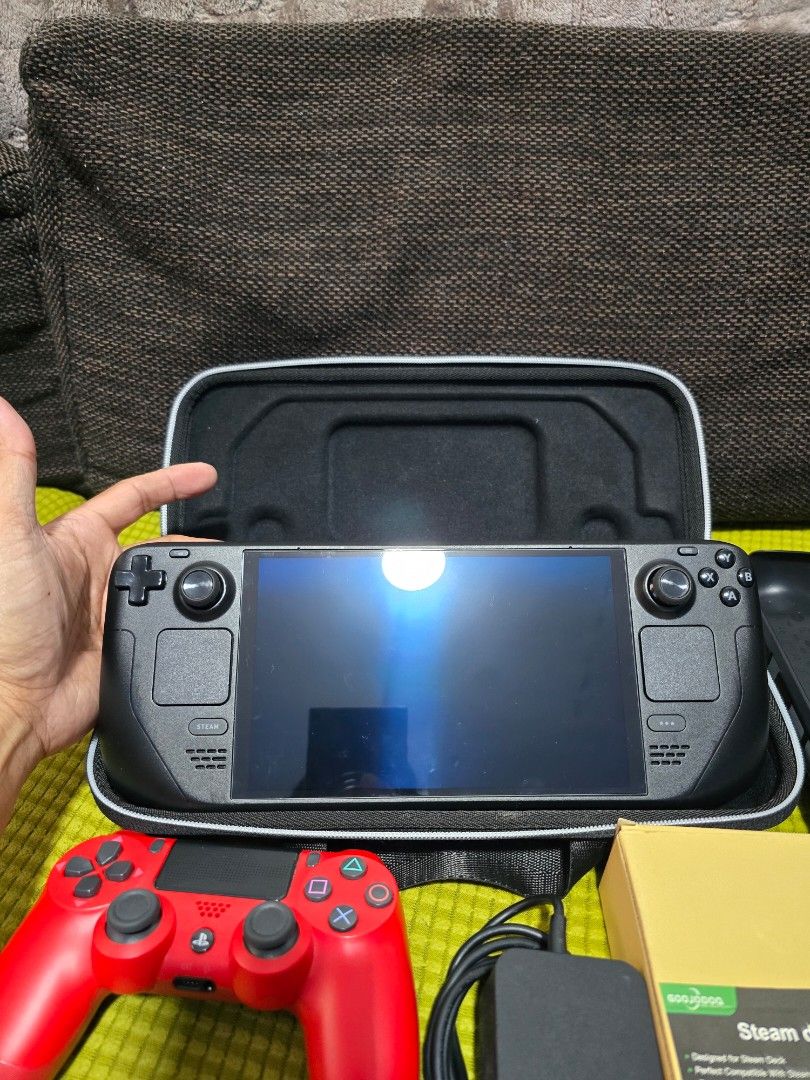 Valve Steam Deck Bundle with Dock and Controller (Category: Others) located in Caloocan City. Submitted by jesonvillegas (Listing ID 1465807816, Image 3). Description: - Goojodoq Steam Deck dock for easy TV connection - Bright red PS4 wireless controller included - Original power adapter and sturdy protective case - Perfect bundle for gaming on the go or docked at home - Everything shown in the photos is included in the package.