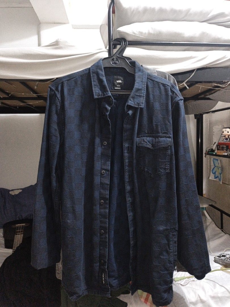 Vans Checkerboard Blue Long Sleeve Button Up Shirt (Category: Formal Shirts) located in Las Pinas. Submitted by sebastians42444 (Listing ID 1465912665, Image 1). Description: - Brand: Vans - Style: Long-sleeve button-up shirt - Color: Dark blue with a subtle woven checkerboard pattern - Details: Single left chest pocket, classic collar, and dark front buttons - Fit/Usage: Great casual piece for layering over t-shirts.