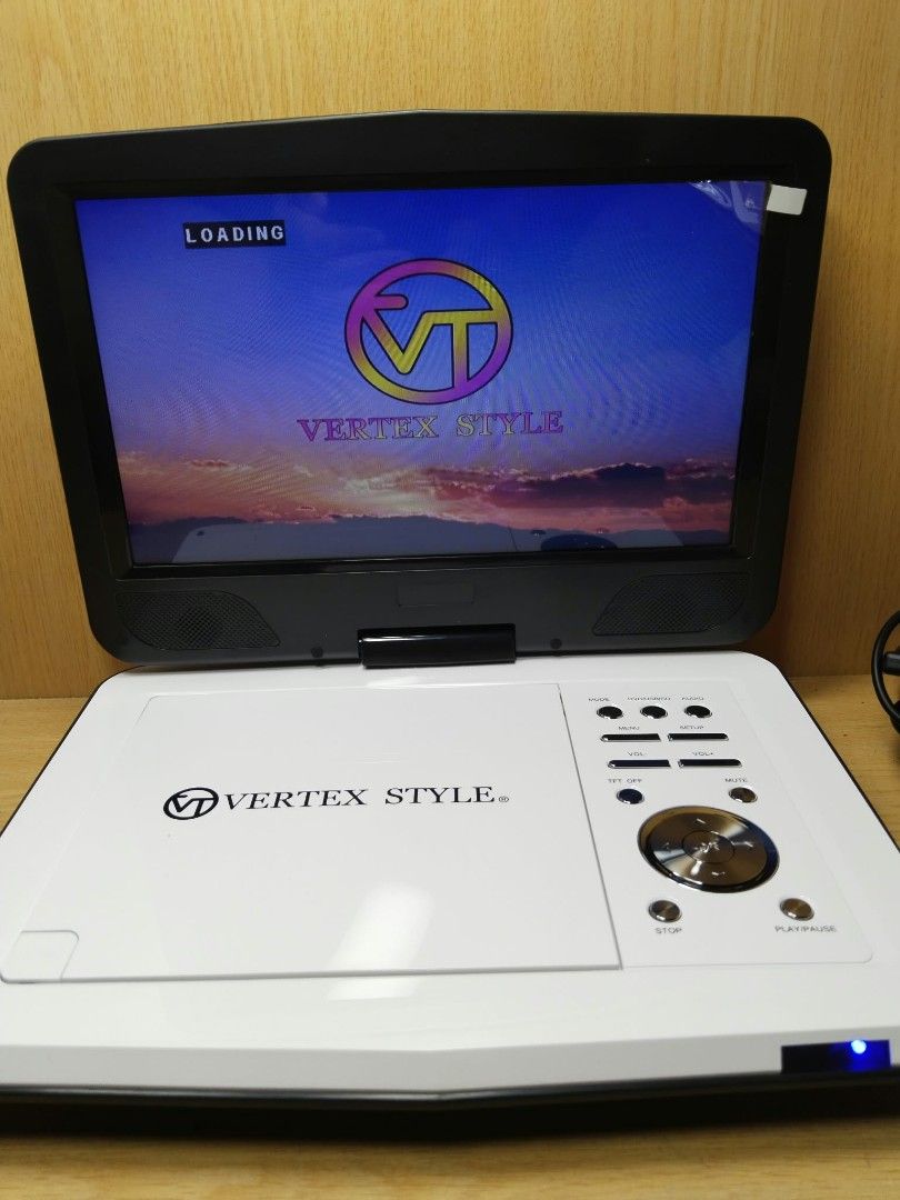 Vertex Style Portable DVD Player (Category: Portable Music Players) located in Davao. Submitted by washerjeni08452 (Listing ID 1465829149, Image 3). Description: - Brand: Vertex Style - Color: White and Black - Condition: Tested and works great, clean unit with a bright screen - Features: TV display settings, Dolby audio, video, and preference menu options - Compatibility: Plays standard DVDs smoothly - features dvd,vcd &CDs player USB player SD 