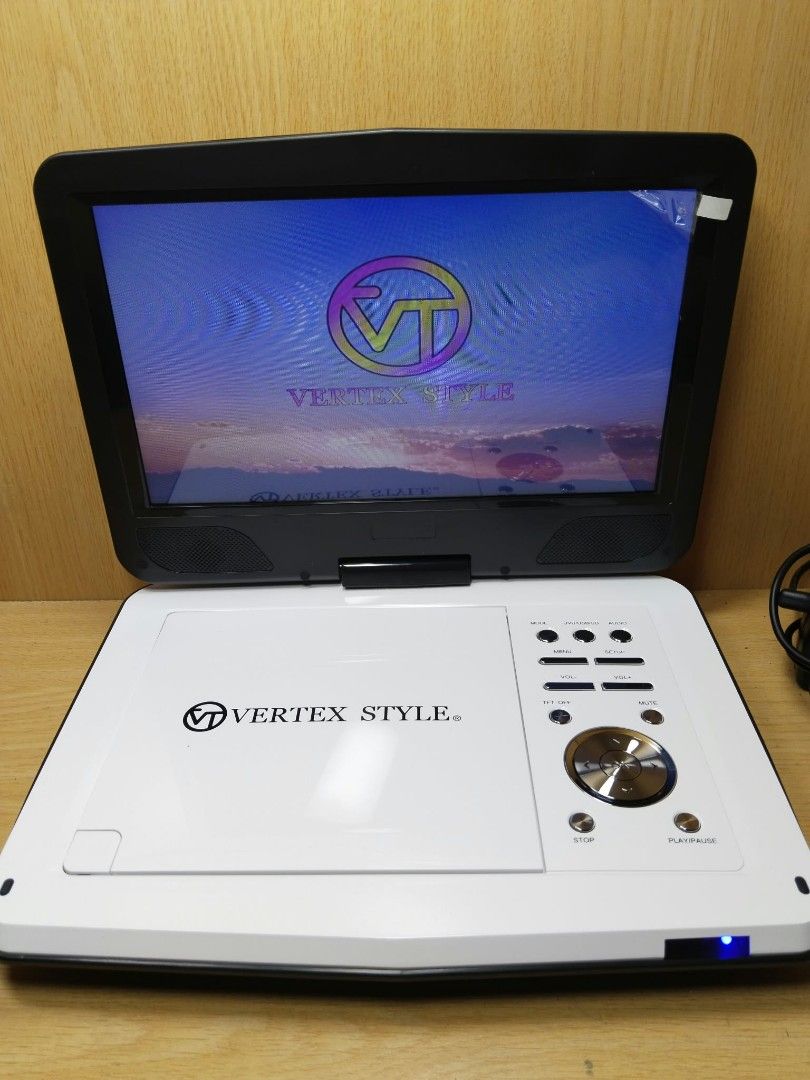 Vertex Style Portable DVD Player (Category: Portable Music Players) located in Davao. Submitted by washerjeni08452 (Listing ID 1465829149, Image 1). Description: - Brand: Vertex Style - Color: White and Black - Condition: Tested and works great, clean unit with a bright screen - Features: TV display settings, Dolby audio, video, and preference menu options - Compatibility: Plays standard DVDs smoothly - features dvd,vcd &CDs player USB player SD 