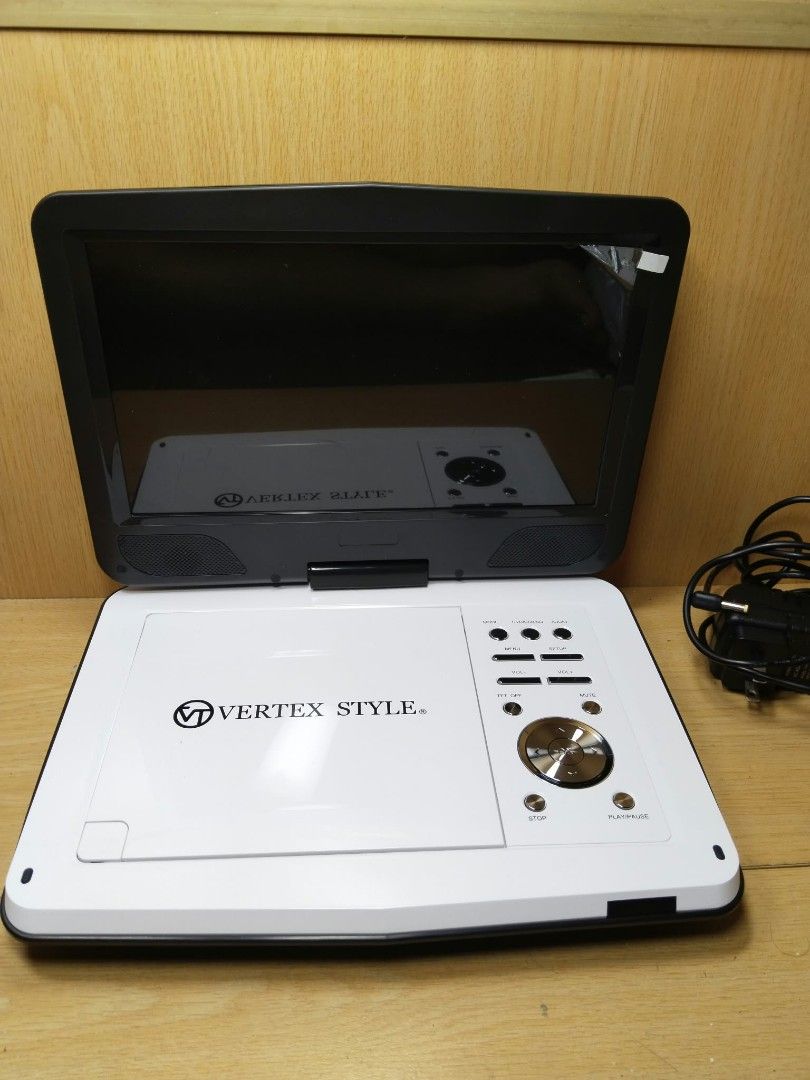 Vertex Style Portable DVD Player (Category: Portable Music Players) located in Davao. Submitted by washerjeni08452 (Listing ID 1465829149, Image 2). Description: - Brand: Vertex Style - Color: White and Black - Condition: Tested and works great, clean unit with a bright screen - Features: TV display settings, Dolby audio, video, and preference menu options - Compatibility: Plays standard DVDs smoothly - features dvd,vcd &CDs player USB player SD 