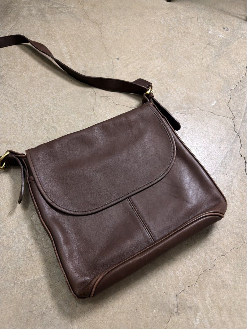Vintage Coach Whitney Bag (Category: Luxury Bags & Wallets) located in Alfonso. Submitted by jbcamet (Listing ID 1465921231, Image 2). Description: - Authentic vintage Coach crossbody bag in rich dark brown leather - Classic flap closure with a soft suede interior lining - Features sturdy brass hardware and the original Coach hangtag - Adjustable strap for a comfortable, customizable fit - Natural wear along the edges adds unique vintage characte