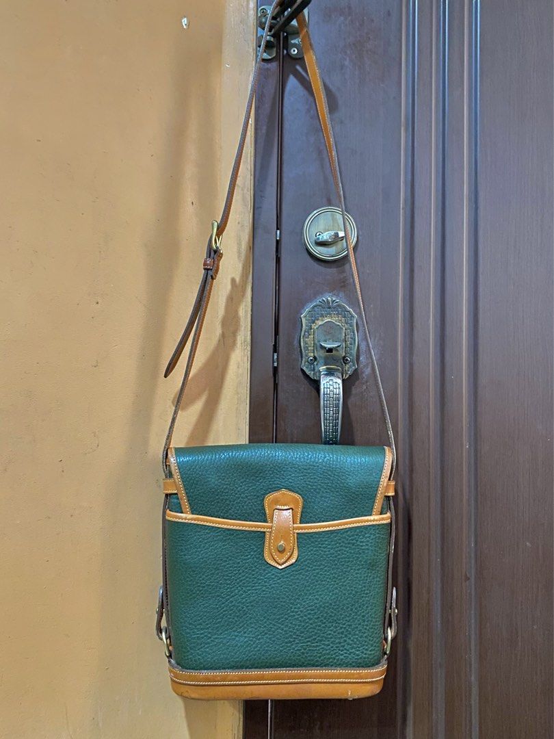 🔥Vintage Dooney & Bourke Cavalry Spectator Bag | Authentic (Category: Luxury Bags & Wallets) located in Cebu City. Submitted by kantocloset_ubec (Listing ID 1465884543, Image 2). Description: -💯Authentic Dooney & Bourke - This is a vintage bag ‘CAVALRY COLLECTION’ - Materials: Crafted using their famous textured ALL-WEATHER LEATHER - Color: Fir green w/ British tan leather trim and solid brass hardware - Near-Mint / Pristine condition - The har