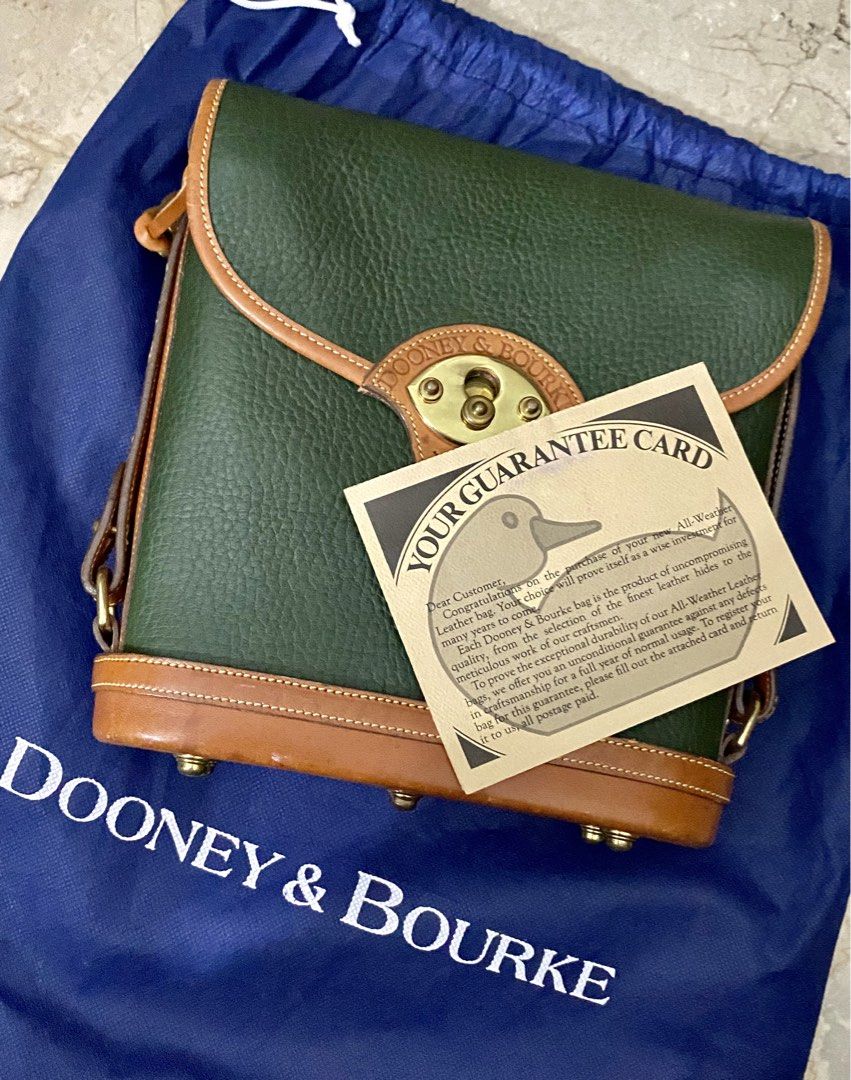 🔥Vintage Dooney & Bourke Cavalry Spectator Bag | Authentic (Category: Luxury Bags & Wallets) located in Cebu City. Submitted by kantocloset_ubec (Listing ID 1465884543, Image 3). Description: -💯Authentic Dooney & Bourke - This is a vintage bag ‘CAVALRY COLLECTION’ - Materials: Crafted using their famous textured ALL-WEATHER LEATHER - Color: Fir green w/ British tan leather trim and solid brass hardware - Near-Mint / Pristine condition - The har