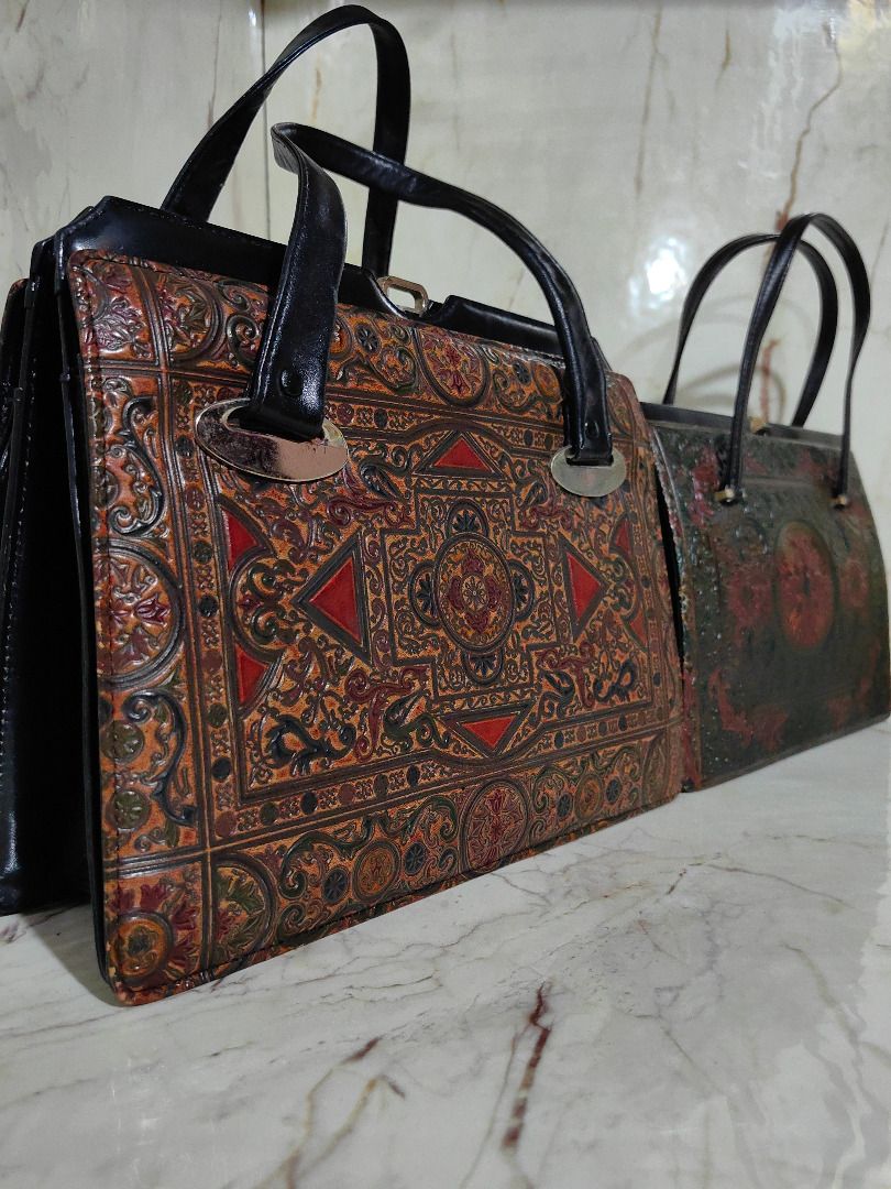 Vintage Handbag Embossed Leather Patterned (Category: Shoulder Bags) located in Tarlac. Submitted by jeremiah.curator.2026 (Listing ID 1465790398, Image 1). Description: - Vintage-style textured handbag with intricate embossed patterns - Striking multi-color design in orange, black, and red tones - Structured frame opening with secure double top handles - Spacious interior with multiple compartments for easy organization - Clean lining featuring 